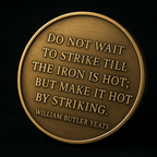 Brass coin with engraved quote on a black background